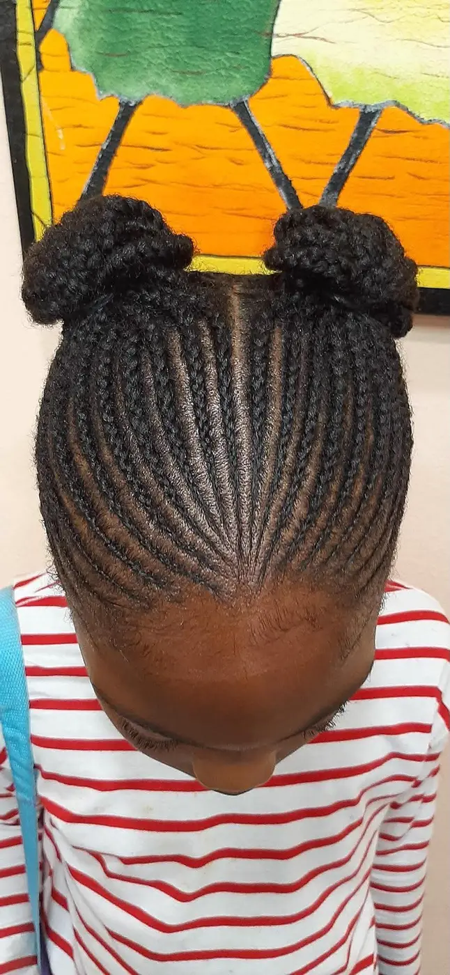 Cornrows gathered into two high buns